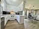 Bright kitchen with white cabinets, modern appliances, and an open layout connected to the dining area at 207 Longstreet St, Summerville, SC 29486