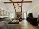 Comfortable living room with a brick fireplace, wood beams, and ample natural light at 207 Longstreet St, Summerville, SC 29486