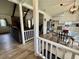 Open-concept living spaces with hardwood floors, a cozy living room, and an adjacent dining area at 207 Longstreet St, Summerville, SC 29486