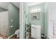 This bathroom features a modern vanity, framed mirror, tiled shower, and updated fixtures at 208 Sea Cloud Cir, Edisto Island, SC 29438