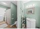 This bathroom has modern fixtures, a sleek vanity with storage, and a shower with decorative tiling at 208 Sea Cloud Cir, Edisto Island, SC 29438