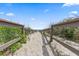 Sandy pathway leading to the beach, framed by dunes and wooden railings at 208 Sea Cloud Cir, Edisto Island, SC 29438