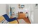 This bedroom features a futon, a mounted TV, and bright windows at 208 Sea Cloud Cir, Edisto Island, SC 29438
