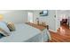 This serene bedroom features hardwood floors, a cozy queen bed, and a mounted TV for ultimate relaxation at 208 Sea Cloud Cir, Edisto Island, SC 29438