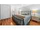 Enjoy this calm bedroom offering hardwood floors, matching bedside tables, and ample closet space at 208 Sea Cloud Cir, Edisto Island, SC 29438