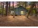 Inviting exterior of a home nestled in the woods with a deck at 208 Sea Cloud Cir, Edisto Island, SC 29438