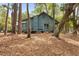 Exterior of a charming home nestled in a wooded lot with a deck at 208 Sea Cloud Cir, Edisto Island, SC 29438