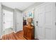 Bright foyer with wood floors, console table, and coat closet in a well-lit entryway at 208 Sea Cloud Cir, Edisto Island, SC 29438