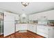Galley kitchen features white cabinets, stainless steel appliances and lots of counter space at 208 Sea Cloud Cir, Edisto Island, SC 29438