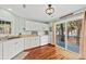 Bright kitchen with stainless appliances, counter space, and sliding glass door to deck at 208 Sea Cloud Cir, Edisto Island, SC 29438
