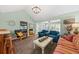 Cozy living room featuring stylish furnishings, a vaulted ceiling, and ample natural light at 208 Sea Cloud Cir, Edisto Island, SC 29438