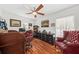 A home office featuring wood floors, desk, shelving, and ample natural light at 208 Sea Cloud Cir, Edisto Island, SC 29438