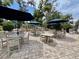 Outdoor patio seating with tables, umbrellas, and scenic views of the playground at 208 Sea Cloud Cir, Edisto Island, SC 29438
