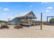 Beachside pavilion with picnic tables, volleyball, and a shaded area for relaxation and activities at 208 Sea Cloud Cir, Edisto Island, SC 29438