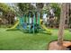 Well-maintained playground with vibrant, modern equipment and soft turf at 208 Sea Cloud Cir, Edisto Island, SC 29438