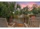 Scenic pond view with a fountain, framed by lush greenery and comfortable lounge chairs at 208 Sea Cloud Cir, Edisto Island, SC 29438