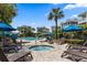 Community pool and spa with lounge chairs surrounded by tropical landscaping at 208 Sea Cloud Cir, Edisto Island, SC 29438