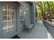 Relaxing porch featuring a bench and inviting door access to a home at 208 Sea Cloud Cir, Edisto Island, SC 29438