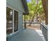 Enjoy the outdoors from this porch with railing in a wooded area at 208 Sea Cloud Cir, Edisto Island, SC 29438