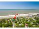 Aerial of home near beach, with charming Isle of Palms homes and pier visible at 220 E Arctic Ave, Folly Beach, SC 29439