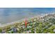 Gorgeous aerial view of the house near the beach, featuring beach access and lush landscaping at 220 E Arctic Ave, Folly Beach, SC 29439