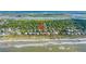 Aerial view of a lovely coastal neighborhood with easy access to the beach and waterway at 220 E Arctic Ave, Folly Beach, SC 29439