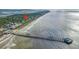 Stunning aerial view showcases home's proximity to Isle of Palms beaches and pier at 220 E Arctic Ave, Folly Beach, SC 29439