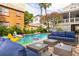 Inviting outdoor living space with comfortable seating and a sparkling swimming pool at 220 E Arctic Ave, Folly Beach, SC 29439