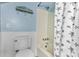 Bathroom showcasing a shower/tub with starfish shower curtain and beach themed decor at 220 E Arctic Ave, Folly Beach, SC 29439