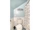 Cozy bathroom with blue walls, starfish decor, and shower-tub with decorative curtain at 220 E Arctic Ave, Folly Beach, SC 29439