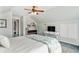 Bright bedroom featuring beach-themed decor, ceiling fan, and light-colored walls at 220 E Arctic Ave, Folly Beach, SC 29439