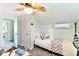 Cozy bedroom featuring nautical decor, a ceiling fan, and a bright interior at 220 E Arctic Ave, Folly Beach, SC 29439