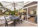 Outdoor deck featuring a dining table, seating area, and screened-in porch, perfect for outdoor dining and relaxation at 220 E Arctic Ave, Folly Beach, SC 29439