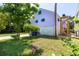 Charming pastel home with lush lawn and ample space for parking at 220 E Arctic Ave, Folly Beach, SC 29439