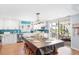 Bright and airy kitchen with white cabinets, stainless steel appliances, and a large island for food prep and seating at 220 E Arctic Ave, Folly Beach, SC 29439