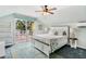 Bedroom with balcony access, light blue walls, and coastal-themed decor at 220 E Arctic Ave, Folly Beach, SC 29439