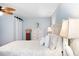 Comfortable bedroom with white furniture, a ceiling fan, and soft blue walls at 220 E Arctic Ave, Folly Beach, SC 29439