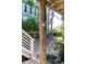 Outdoor shower is conveniently located on a wooden post, adjacent to the stairs and yard at 220 E Arctic Ave, Folly Beach, SC 29439