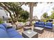 Inviting brick patio with outdoor seating and lush foliage, perfect for relaxing or entertaining guests at 220 E Arctic Ave, Folly Beach, SC 29439