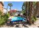 Refreshing backyard pool with mature trees creating shade, perfect for cooling off during warm weather at 220 E Arctic Ave, Folly Beach, SC 29439