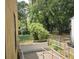 Backyard view from the elevated deck with metal railings and mature trees at 2313 Aintree Ave, North Charleston, SC 29405