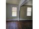 Bright living room featuring hardwood floors, natural light, and white trim, providing a cozy atmosphere at 2313 Aintree Ave, North Charleston, SC 29405