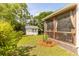 Beautiful backyard featuring a screened porch, storage shed, and lush greenery, creating a serene outdoor oasis at 2632 Planters Pointe Blvd, Mount Pleasant, SC 29466