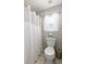 Clean bathroom featuring a toilet, shower with white curtain, tile floor and window at 2632 Planters Pointe Blvd, Mount Pleasant, SC 29466
