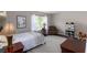 Bright bedroom featuring a large window, reading chair, and a cozy bed at 2632 Planters Pointe Blvd, Mount Pleasant, SC 29466