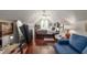 Attic bedroom with hardwood floors, natural light, bed, dresser and sitting area with blue sofa at 2632 Planters Pointe Blvd, Mount Pleasant, SC 29466