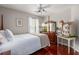 Traditional bedroom featuring a four poster bed, dresser with mirror and hardwood floors at 2632 Planters Pointe Blvd, Mount Pleasant, SC 29466