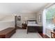 Comfortable bedroom with hardwood floors, natural light, and a cozy bed under the window at 2632 Planters Pointe Blvd, Mount Pleasant, SC 29466
