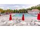Expansive community pool featuring ample seating, umbrellas, and a refreshing atmosphere for summertime enjoyment at 2632 Planters Pointe Blvd, Mount Pleasant, SC 29466