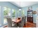 Bright dining room featuring wood floors, stylish furnishings, and large windows offering scenic outdoor views at 2632 Planters Pointe Blvd, Mount Pleasant, SC 29466